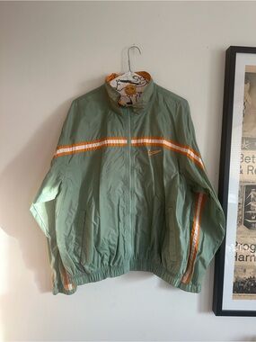 Nike Sage Windbreaker Jacket with Orange and White Stripes